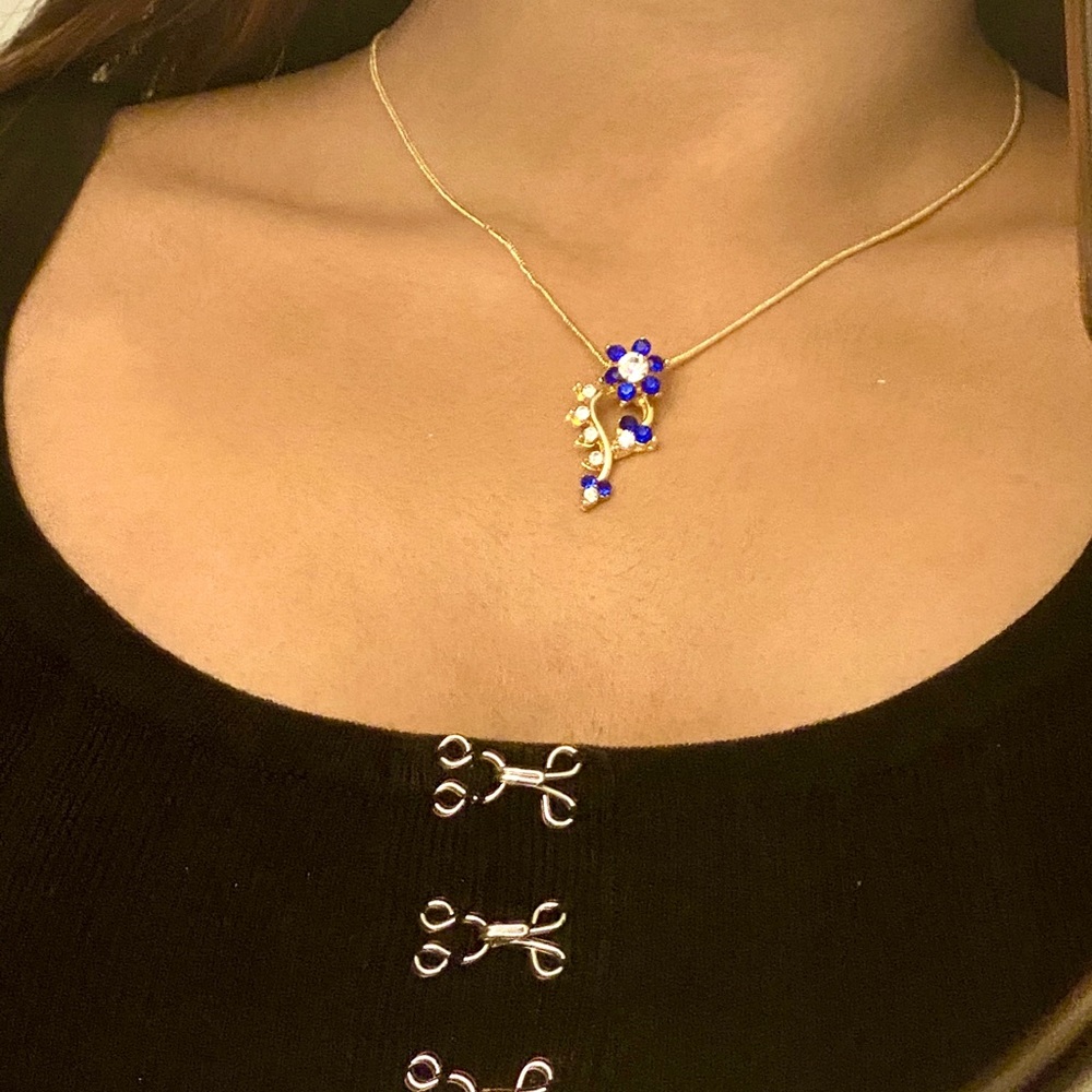 Blue flower pendant set with matching earrings